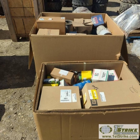 2 BOXES. MISC HEAVY EQUIPMENT AND TRUCK PARTS, INCLUDING: FILTERS, LIGHTS, SEALS, CAT, GM, MERITOR,