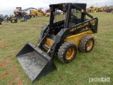 NEW HOLLAND LX665 SKID STEER SN67778 powered by diesel engine, equipped with rollcage, auxiliary hyd