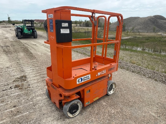 SNORKEL TM12E SCISSOR LIFT SN:600348 electric powered, equipped with 12ft. Platform height, slide