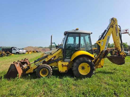 NEW HOLLAND B95 TRACTOR LOADER BACKHOE SN:55747 4x4, powered by diesel engine, equipped with EROPS,