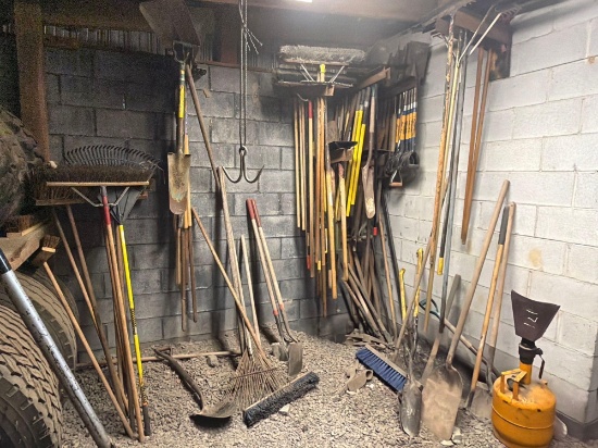 Wall Of Misc Brooms, Shovels, And Yard Tools Support Equipment