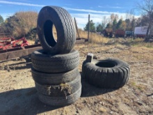 STACK OF MISCELLANEOUS TIRES SUPPORT EQUIPMENT