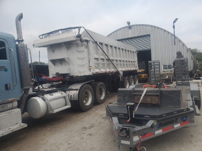 1987 HILL DUMP TRAILER equipped with 45 yard aluminum dump body, electric tarp, triaxle.