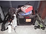 Lot on shelf of scooter, tennis rackets, tri-pod, games, walkie talkies, clay targets, pong, etc.