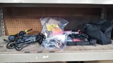 Lot on Shelf of Various Electric Staple Guns, Staples, Rechargeable Screw Driver, Black & Decker