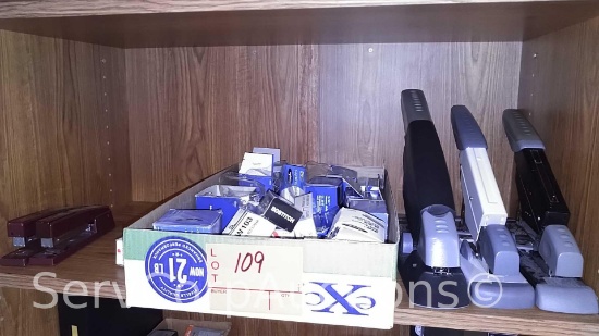 Lot on Shelf of Various Staplers & Staples
