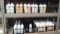 Lot on 2 Shelves of approx. 70 Condiment Squeeze Bottles with 17 Condiment Caddies