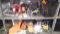 Lot on 2 Shelves of Various Furniture Sliders, Bicycle Baskets, Headband Flashlights, Belts, Eye