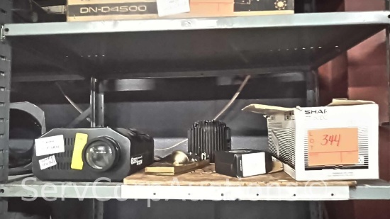 Lot on Shelf of American DJ Gobo Scope Light, Various Music CD's, HID Conversion Lamps, LeFlector