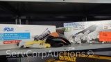 Lot on Shelf of Blue Hawk Tile Cutter, Dremel Ultra Saw, Knee Pads, Safety Glasses, Gloves