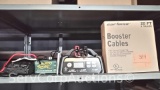 Lot on Shelf of Cartman Booster Cables, Ampeak Smart Charger, Deltran Battery Tender Trickle