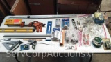 Lot on Shelf of Various Levels, T-Squares, Tape, Clamps, Hitch Locks, Marina Horns, Sandpaper, Rags,