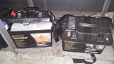 Lot on Shelf of 2 Renogy Sealed Universal 100AH 12-Volt Batteries inside of Minn Kota Industrial