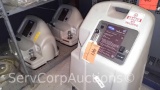 Lot on Shelf of 3 Various Invacare Oxygen Concentrators