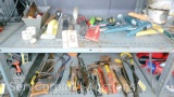 Lot on 2 Shelves of Caulk Guns, Trowels, Hole Saws, Box Cutters, Knives, Hand Saws, Drill Bits,