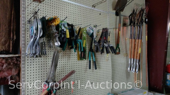 Lot On Wall of Grass Shears, Head Shear, Shovel, Rakes, Cultivator, Water Hose Guides