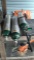 Lot on Shelf of 3 Compressed USP Oxygen Tanks with 1 Oxygen Dolly