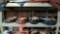 Lot on Shelf of Approximately 73 Belts & a Bag of Various Buckles: Alligator - With tapered ends