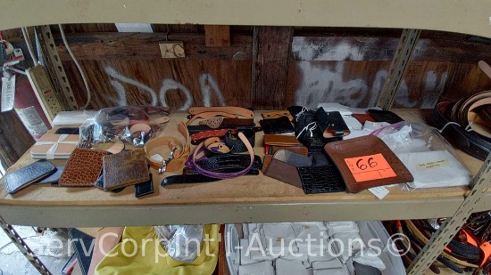 Lot on Shelf of Various Wallets, Magnet Trays, Wrist Bands, Knife Holder, Gun Holder, Glass Case,