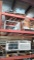 Lot on 3 Shelves of Scale, Galvanized Pipe, Drop Light, Punches, Down Spouts, Gas/Diesel Water Block