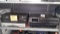 Lot on Shelf of Sony Stereo System, Cisco Explorer, 5-Disc DVD/CD Changer