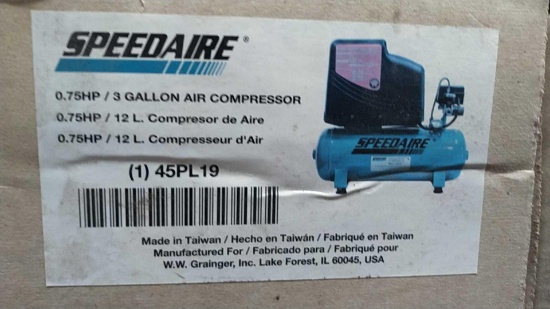 Lot on Shelf of Speedaire 3-Gallon Electric Air Compressor- New in Box, Packaging Damaged