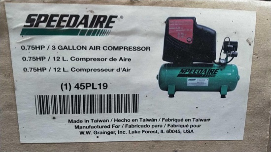 Lot on Shelf of Speedaire 3-Gallon Electric Air Compressor- New in Box, Packaging Damaged