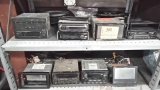Lot on 2 Shelves of Various Car Stereos, Speakers