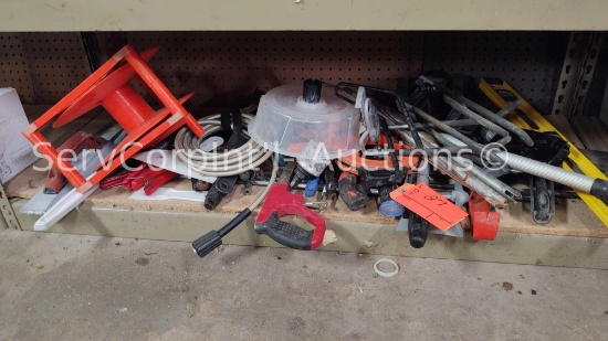 Lot on Shelf of PVC Cutters, Hack Saw, Electric Fish Tape, Level, Pry Bar, Hole Saws, Drill Bits