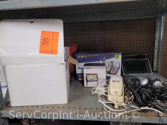 Lot on Shelf of Heelys Skate Shoes, Panasonic Land Line Phone, Emergency TV, Auto Vac,