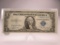 h-240 1935-A $1 Silver Certificate in VF+ with ink on left side