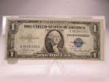 h-240 1935-A $1 Silver Certificate in VF+ with ink on left side