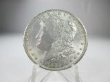 jr-105 Choice UNC 1885-0 Morgan Silver Dollar. Full mint luster on a well struck coin