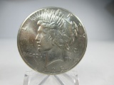 t-78 UNC 1928-P Peace Silver Dollar. Super eye appeal on this well struck key date.