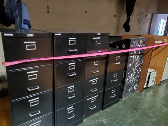 Four filing cabinets two metal desks and lectern