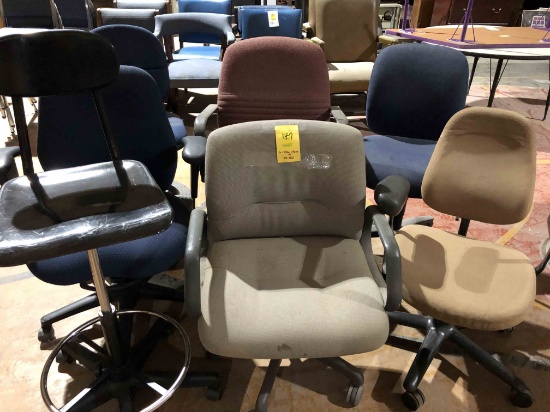 6 rolling chairs and 1 stool