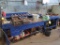 LOT: (1) Work Bench with 5 in. Bench Vise & Assorted Eye Bolts, (1) Table with Assorted Bar Clamps