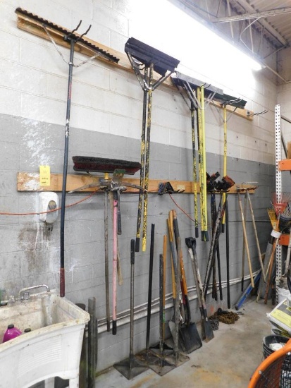 LOT: Large Quantity of Assorted Pavement Tools Along Wall: Tampers, Shovels, Rakes, Post Pounders,