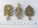 3 Brass Look Trivets - one Wilton