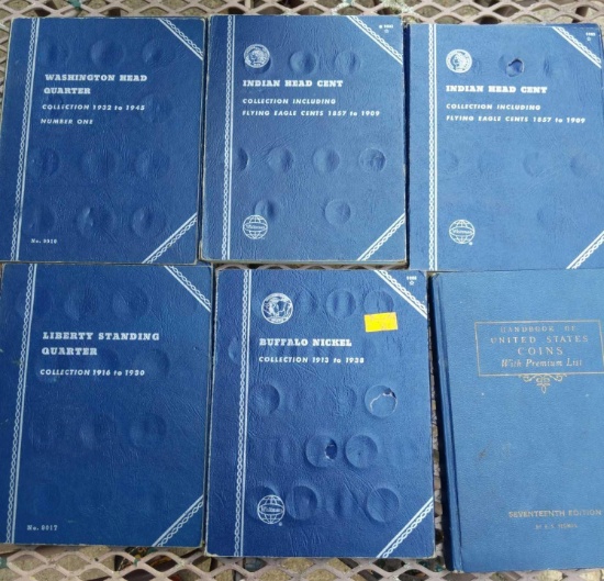 Empty coin books, and a United State coin book