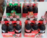 4 - Six Packs of Holiday Coca-Cola Classic with / Santa