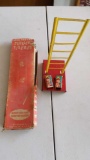 Vintage All Metal Tumbling Firemen Toy