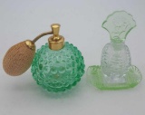 Glass atomizer and perfume bottle on tray