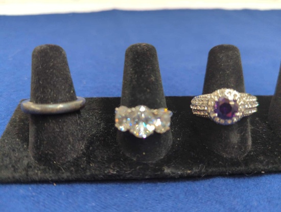 COSTUME RINGS, SIZE 6 BAND, SIZE 9 CLEAR STONE, SIZE8 PURPLE STONE