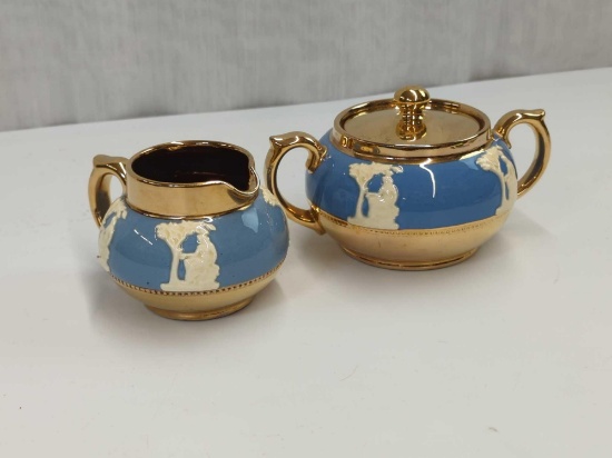 GIBSON ENGLAND CREAM &SUGAR RAISED WHITE FIGURES ON BLUE GOLD TRIM