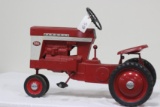 #65 1958 FARMALL 560 PEDAL TRACTOR (MISSING HITCH LATCH, OLDER RESTORATION)