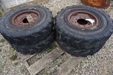 40-1 - (4) HARD TIRES WITH RIMS FOR SKID LOADER. 8.0-16