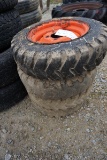 54-4 - (4) 5.7-12NH SKID LOADER TIRES ON RIMS