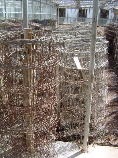 ROW APPROXIMATELY (43) WIRE FENCE ROLLS