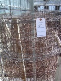 ROW APPROXIMATELY (32) WIRE FENCE ROLLS